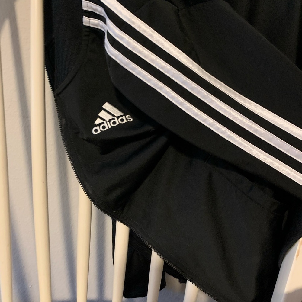 Adidas boys track jacket black zip up with white stripes. Like brand new.